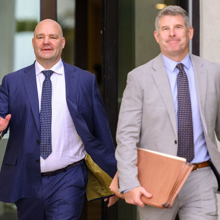 David Whitaker, left, exits District Court on St. Thomas with his attorney, David Cattie, on July 22. 