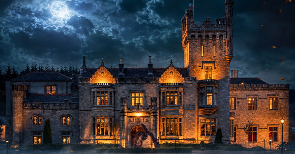 Gothic castle at night with dramatic clouds and full moon, illuminated by warm lights.