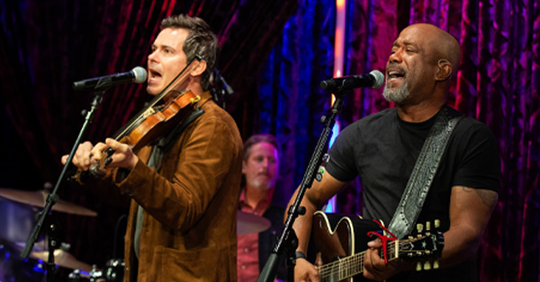 Old Crow Medicine Show’s Ketch Secor and Darius Rucker perform on stage.