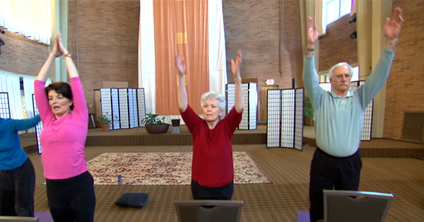 Older adults doing yoga.