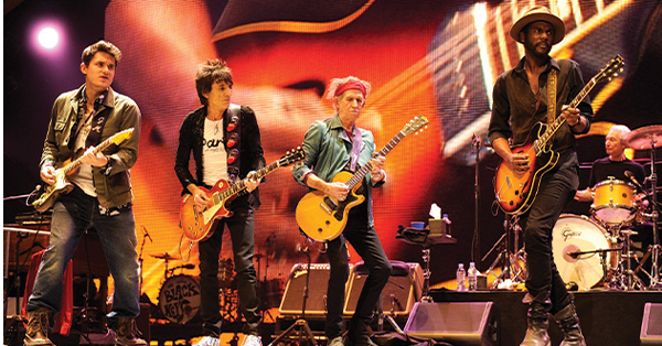 The Rolling Stones performing on stage.