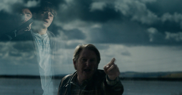 Main Character Ridley is pointing at a reflection of a young man with a gun held to hid head.