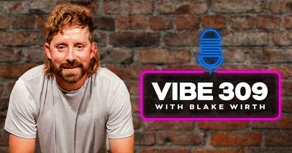 Blake Wirth in front of a brick wall with the Vibe 309 Logo