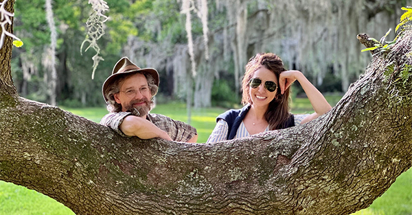 Doc Varn and Sophia Michelen taking a break in the shade of a grand live oak tree at Magnolia Plantation in South Carolina.