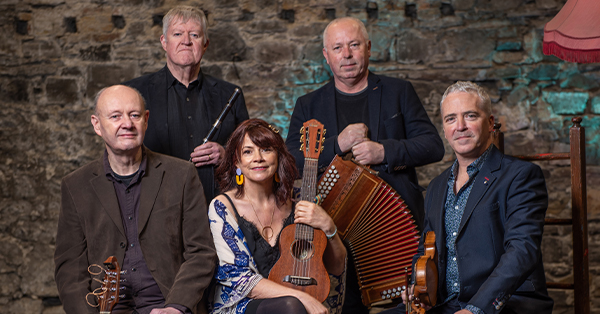  Internationally acclaimed Sligo-based band Dervish siting with instruments in group photo.