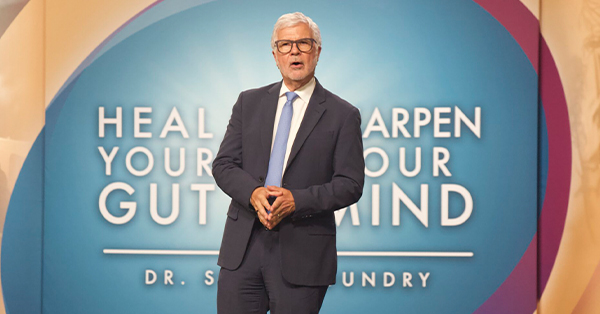Dr. Steven Gundry standing in front of a background with the show name.