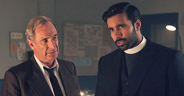 Geordie Keating (Robson Green) and Alphy Kottaram (Rishi Nair) standing in an office talking.